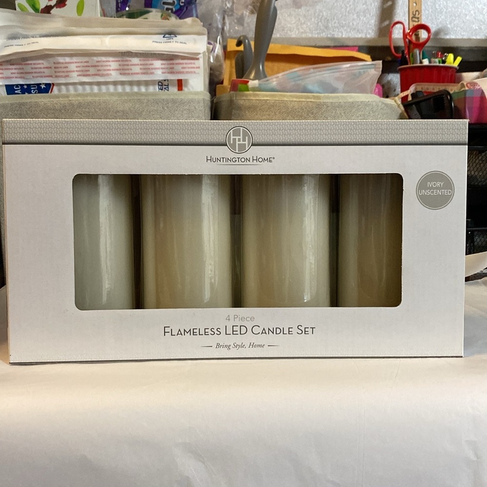New in box Huntington Home 4 piece wax‎ flameless LED unscented ivory candle set